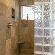 Spa bathroom shower area with slate tile and glass block walls reno | Avon, OH | North Star Premier Custom Homes