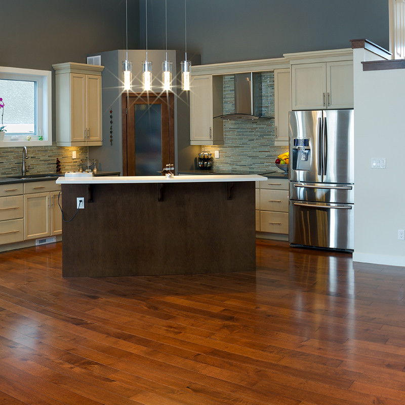 Custom modern kitchen renovation utilizing reclaimed hardwood flooring | Avon, OH | North Star Premier Custom Homes