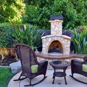 Custom outdoor patio with fire place feature | Avon, OH | North Star Premier Custom Homes