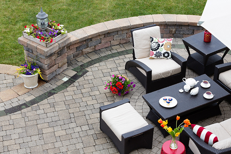Custom outdoor entertainment space with stone patio | Avon, OH | North Star Premier Custom Homes
